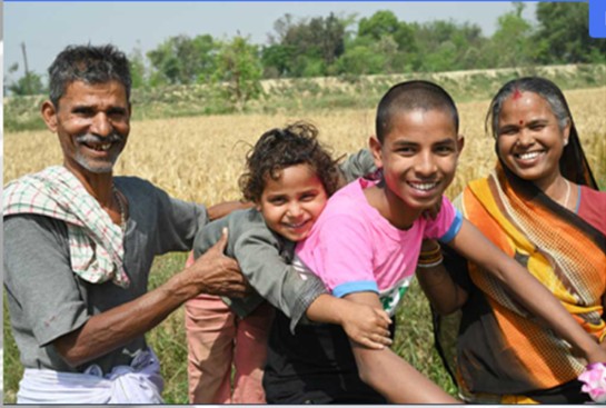 Happy rural family in the field